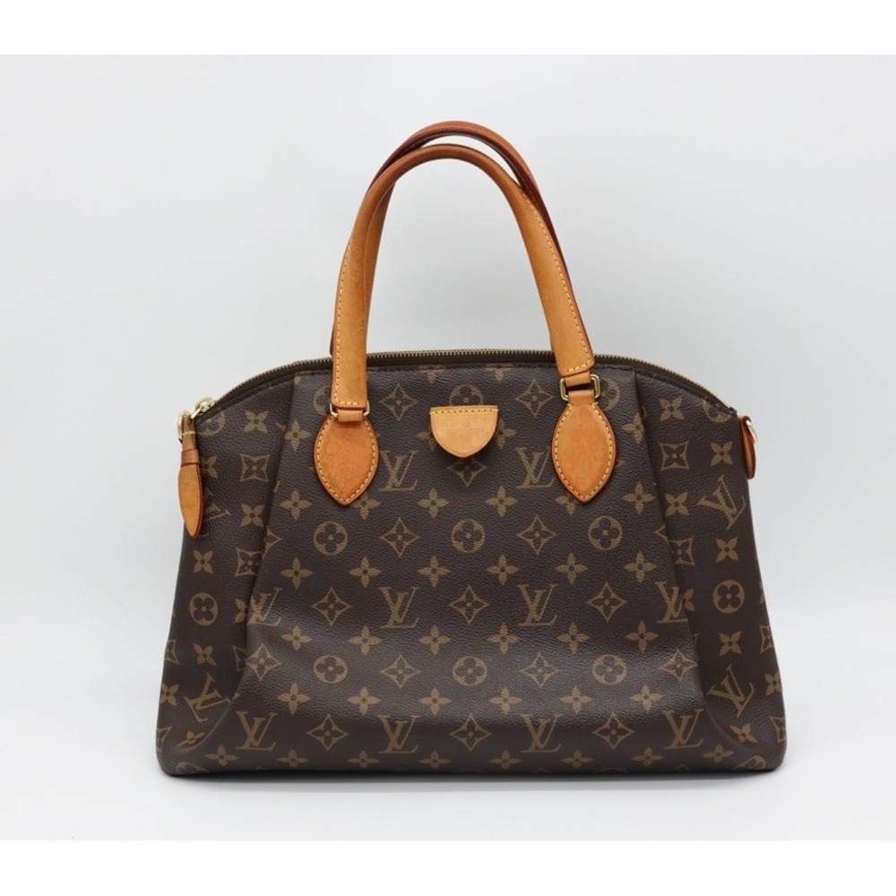 Louis Vuitton Rivoliโ Monogram Bag